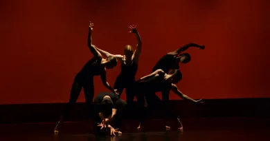dancers posing in darkness