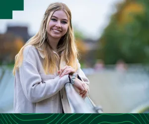 UL student with blonde hair smiles into the camera 
