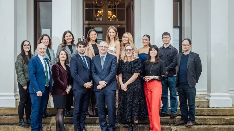 Group of people standing on steps